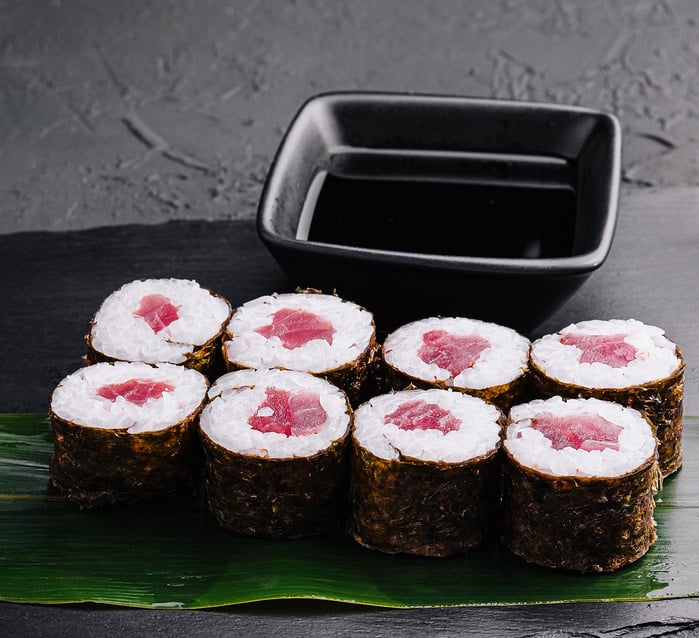 Maki rolls with tuna on black stone