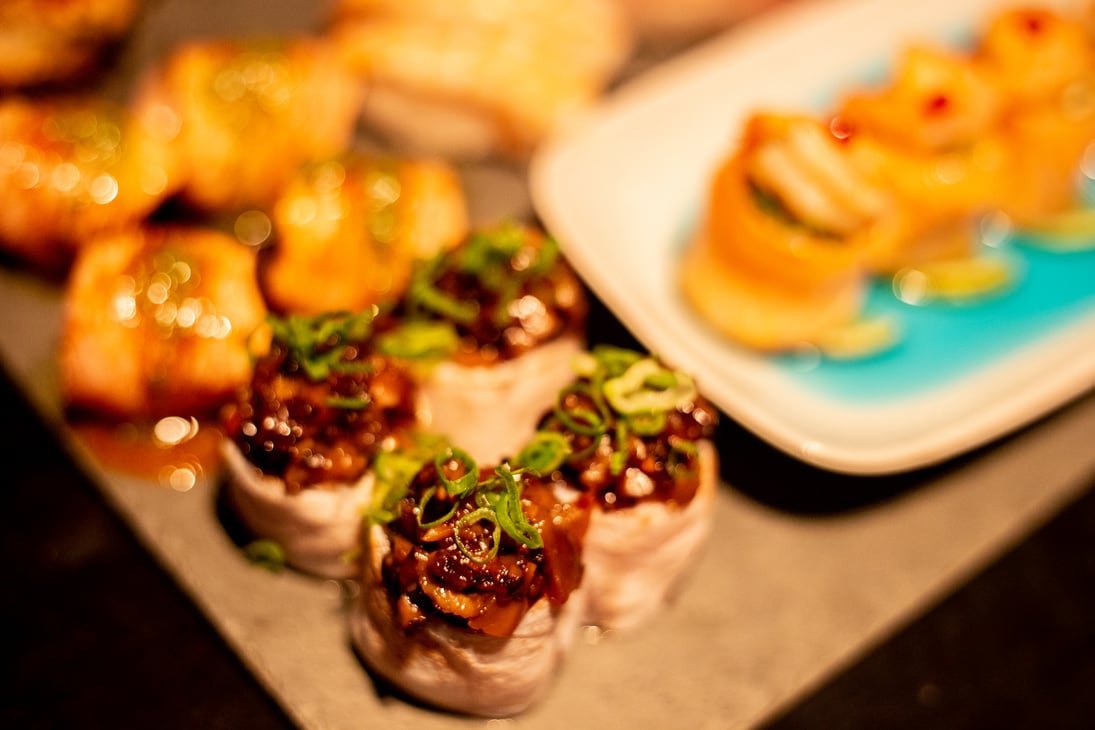 japanese food, salmao nigiri and shrimp on a black plate