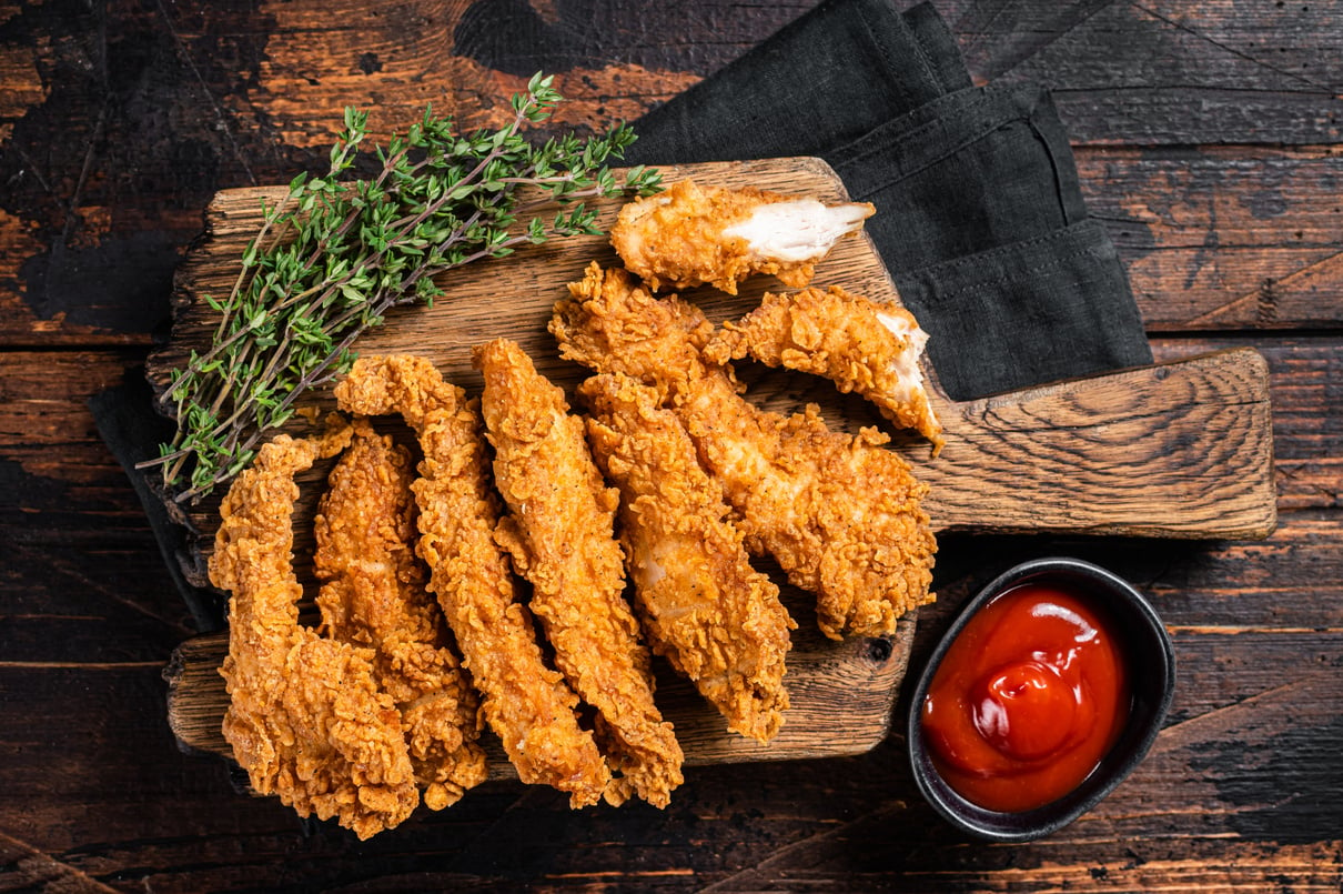 Crispy fried Breaded chicken strips, breast fillet meat with